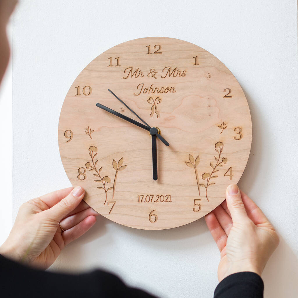 Wooden wall clock made of basswood, engraved with wedding designs, perfect for wedding souvenirs.