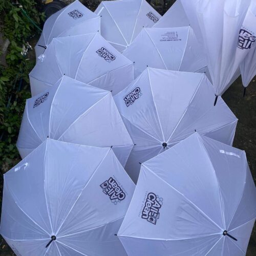 Customized J Umbrella with durable nylon fabric, metal frame, and dotted plastic J-handle. Available for bulk orders.