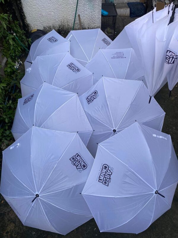 Customized J Umbrella with durable nylon fabric, metal frame, and dotted plastic J-handle. Available for bulk orders.