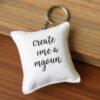 Custom pillow keychains with personalized designs for souvenirs and giveaways.